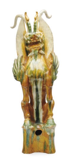 A CHINESE SANCAI-GLAZED POTTERY FIGURE OF AN EARTH SPIRIT,