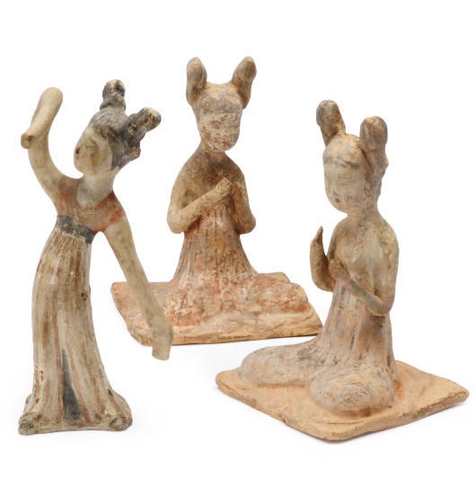 TWO CHINESE PAINTED POTTERY FIGURES OF SEATED LADIES AND A FIGURE OF A DANCER,