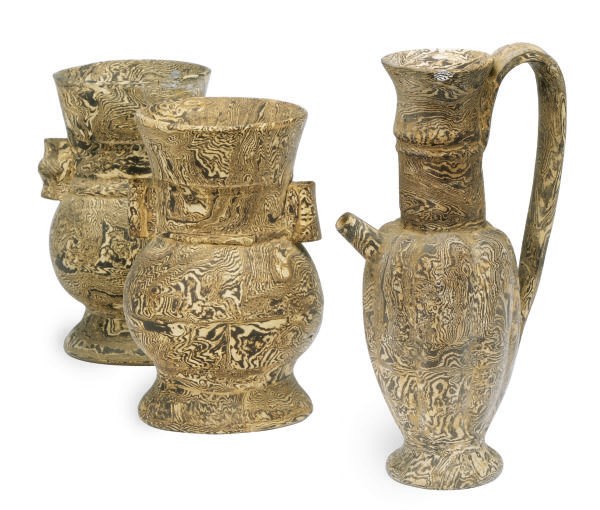 A CHINESE MARBELIZED CERAMIC POURING VESSEL AND TWO HU-FORM VASES,