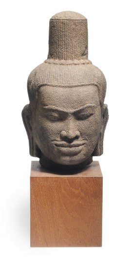 A KHMER SANDSTONE HEAD OF SHIVA,