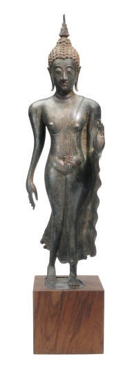 A THAI STRIDING BRONZE FIGURE OF BUDDHA WITH HAND RAISED IN MUDRA,