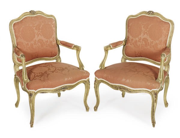 A PAIR OF FRENCH CREAM-PAINTED AND UPHOLSTERED FAUTEUILS,