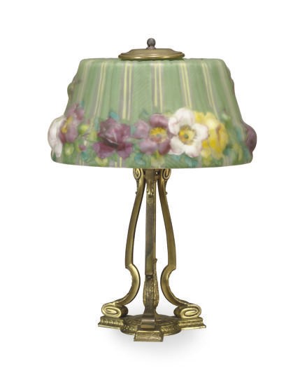 A REVERSE-PAINTED GLASS SHADE AND GILT-METAL TABLE LAMP,