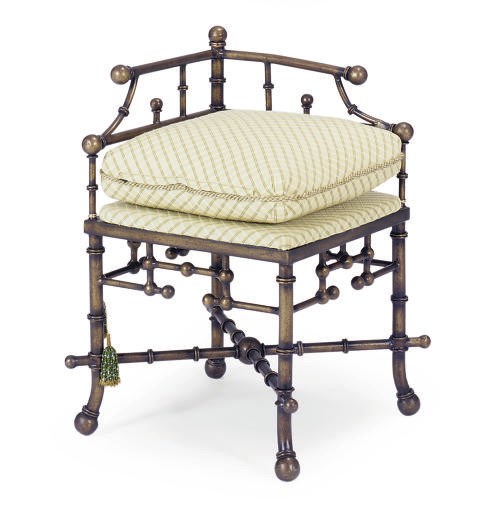 A PATINATED METAL CORNER CHAIR