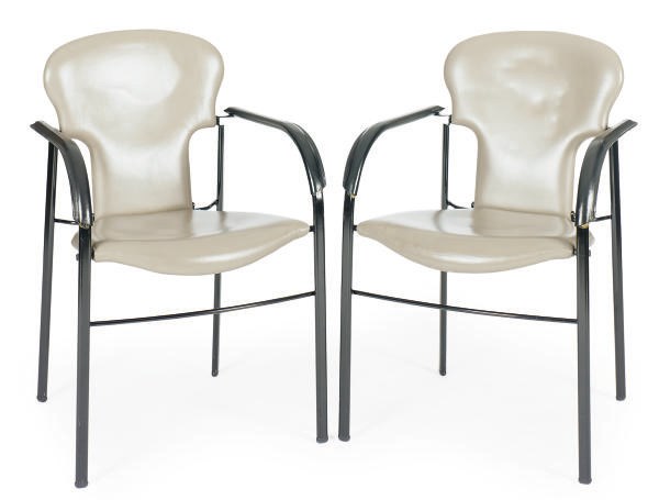 A SET OF FOUR ENAMELED METAL AND LEATHER DINING CHAIRS,