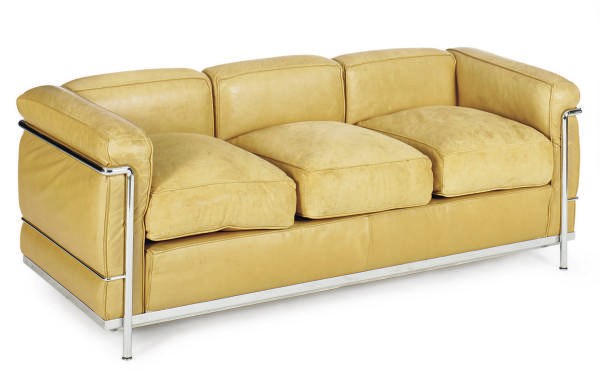 A CHROMIUM-PLATED TUBULAR STEEL AND TAN LEATHER 'LC 2' SOFA,