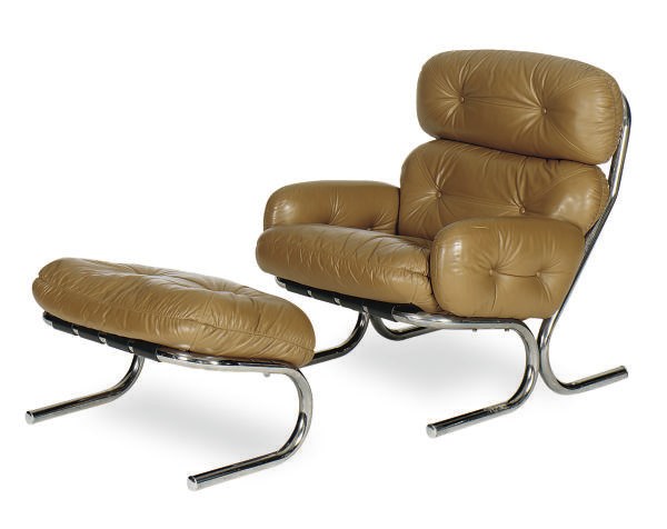 A CHROMED-METAL AND LEATHER LOUNGE CHAIR AND OTTOMAN,