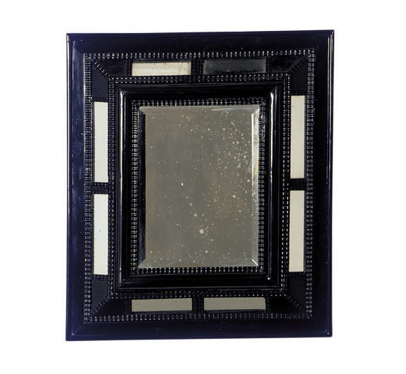 AN EBONIZED MIRROR,