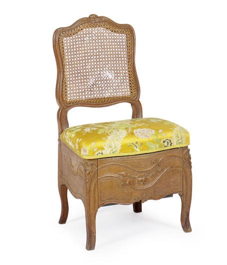 A LOUIS XV WALNUT AND CANED BIDET,