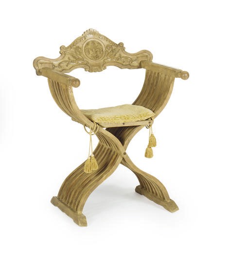 A CONTINENTAL CARVED FRUITWOOD SAVONAROLA CHAIR,