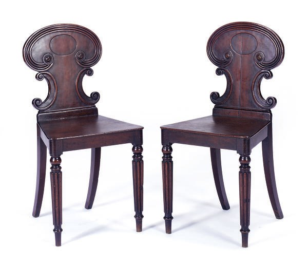 A PAIR OF REGENCY MAHOGANY HALL CHAIRS,