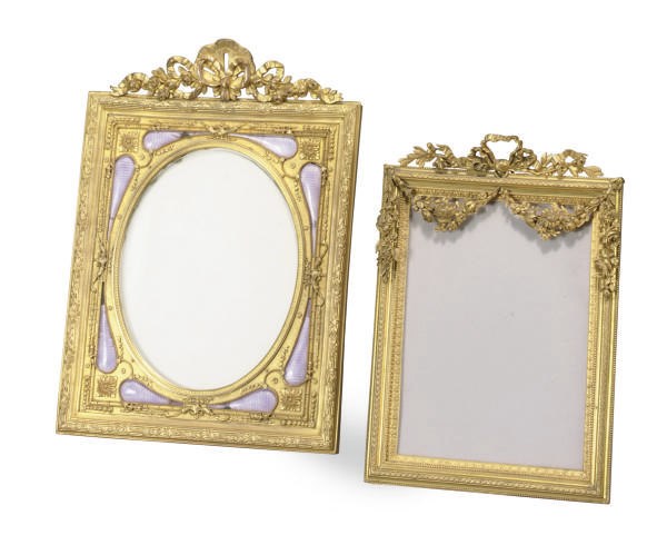 A GILT-BRONZE AND ENAMELED PICTURE FRAME,