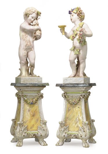 A PAIR OF POLYCHROME-GLAZED EARTHENWARE FIGURES ON PEDESTAL-STANDS,