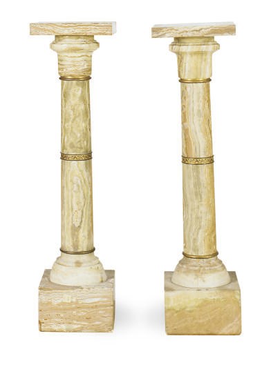 A NEAR PAIR OF ONYX PEDESTALS