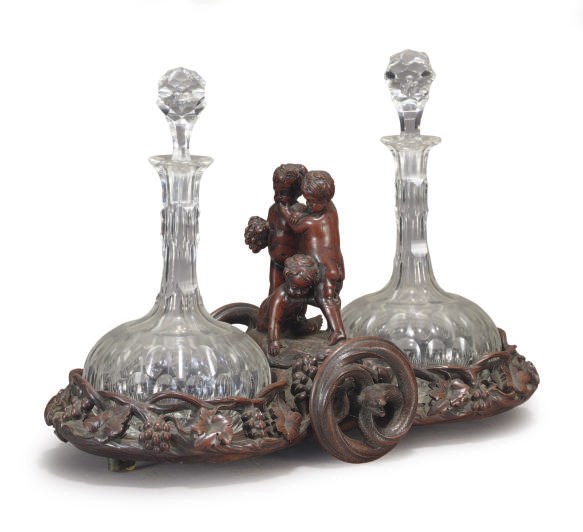 A VICTORIAN STAINED WOOD PORT TROLLEY WITH DECANTERS,