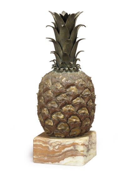 A PATINATED AND GILT-BRONZE MODEL OF A PINEAPPLE,