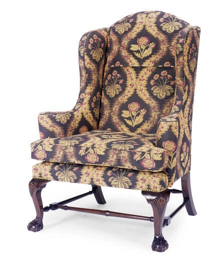 A MAHOGANY AND UPHOLSTERED WINGBACK ARMCHAIR,