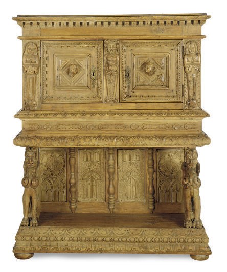 AN OAK COART CUPBOARD,