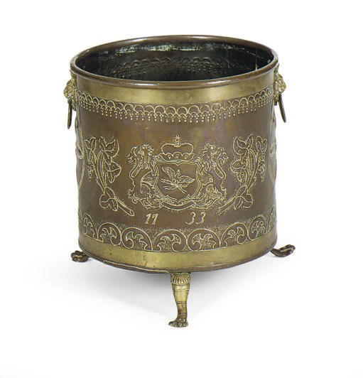 A DUTCH REPOUSSE COPPER AND BRASS JARDINIERE,