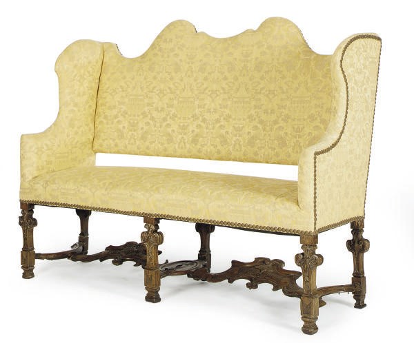 AN ITALIAN WALNUT AND YELLOW DAMASK UPHOLSTERED SETTEE,