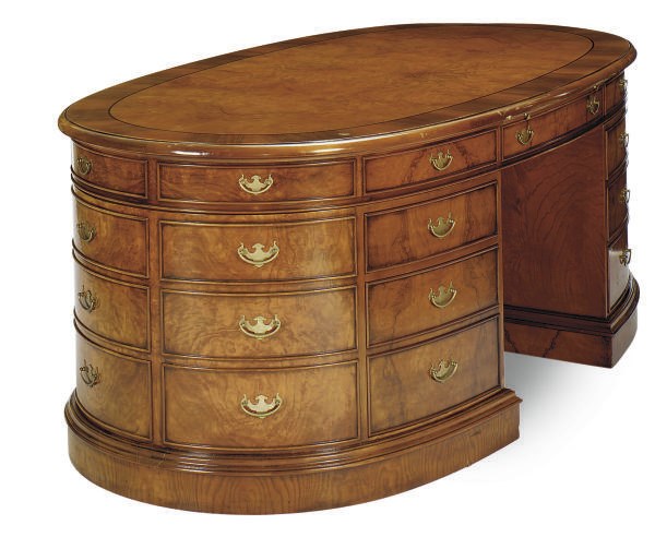 A LARGE MAHOGANY AND ELM OVAL DOUBLE-PEDESTAL DESK,