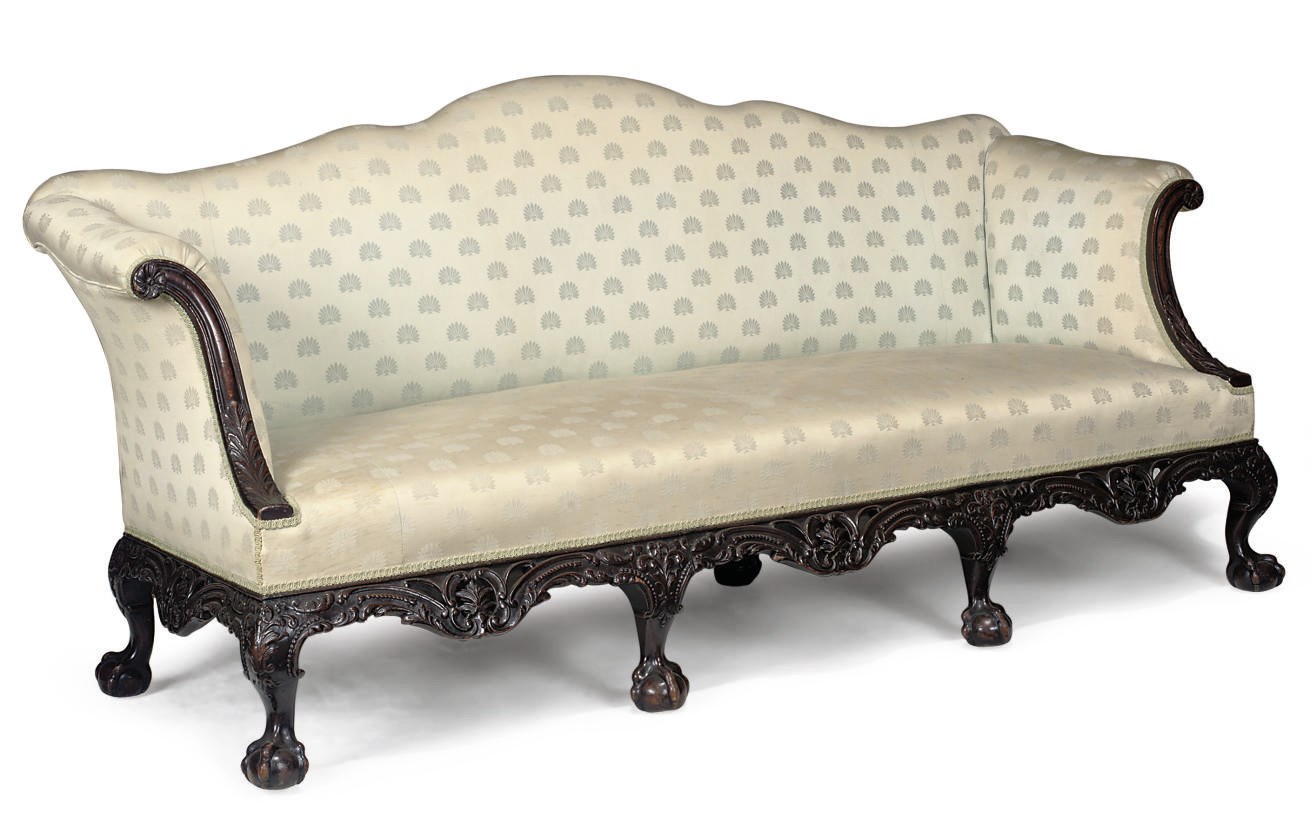 A CARVED MAHOGANY SOFA