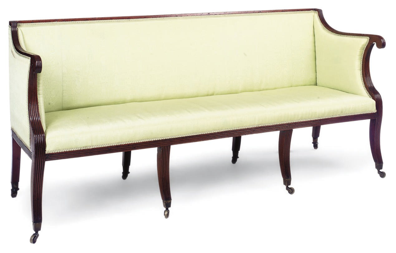 A REGENCY MAHOGANY UPHOLSTERED SOFA