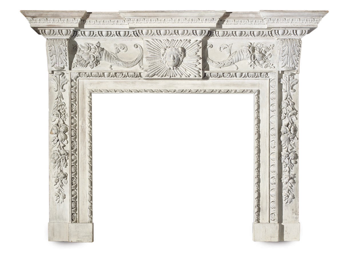 A LIME-WASHED PINE AND GESSO FIRE SURROUND