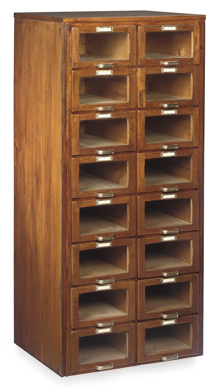 AN OAK AND GLASS MOUNTED HABERDASHERY CABINET