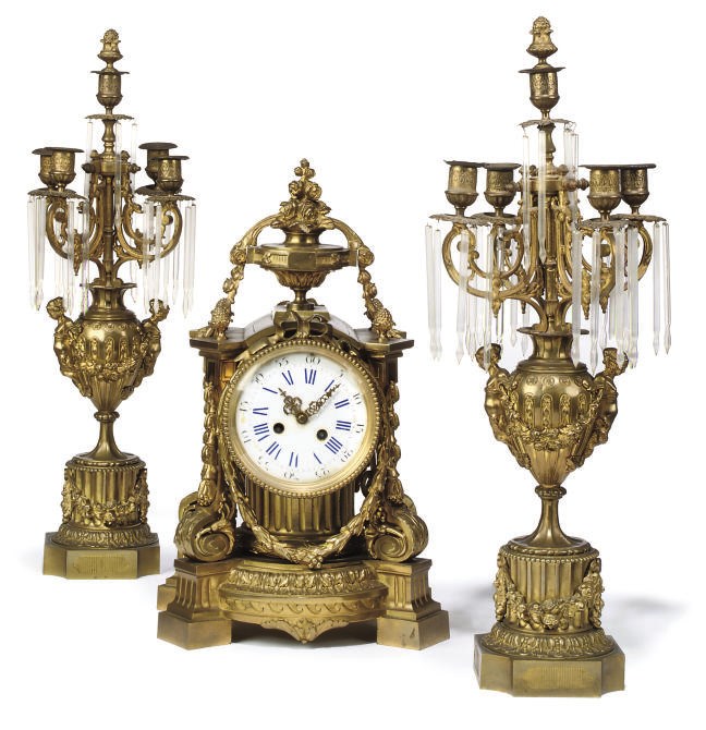 A FRENCH GILT-BRONZE MANTEL CLOCK