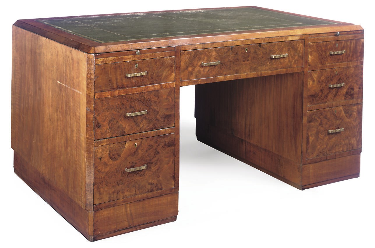 AN ART DECO WALNUT, CROSSBANDED AND GILT-METAL MOUNTED PEDESTAL DESK
