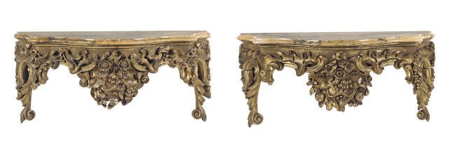 A PAIR OF ITALIAN CARVED GILTWOOD CONSOLE BRACKETS