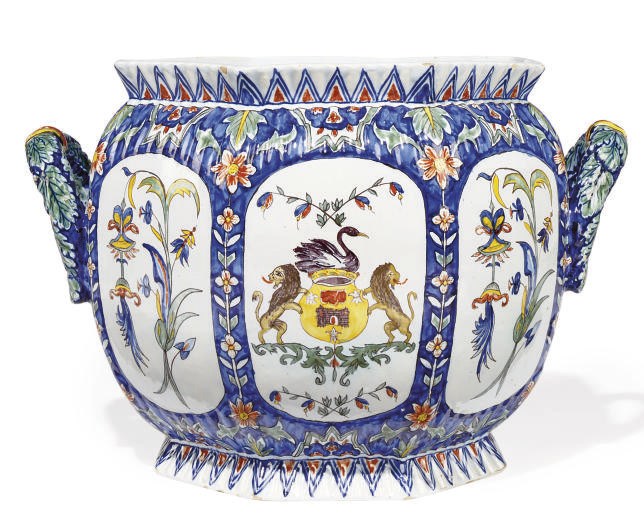 A CONTINENTAL FAIENCE TWO-HANDLED JARDINIERE