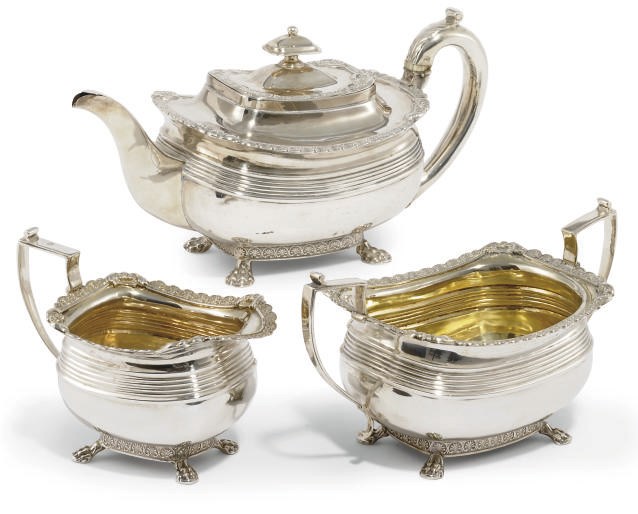 A GEORGE III SILVER THREE-PIECE TEA SET