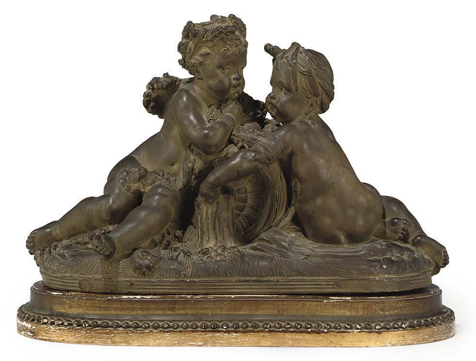 A FRENCH TERRACOTTA GROUP OF PUTTI