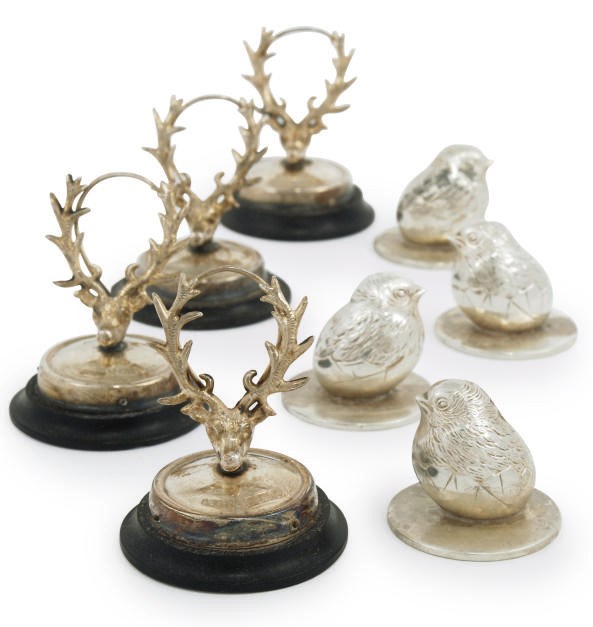 A SET OF FOUR NOVELTY EDWARDIAN SILVER MENU HOLDERS