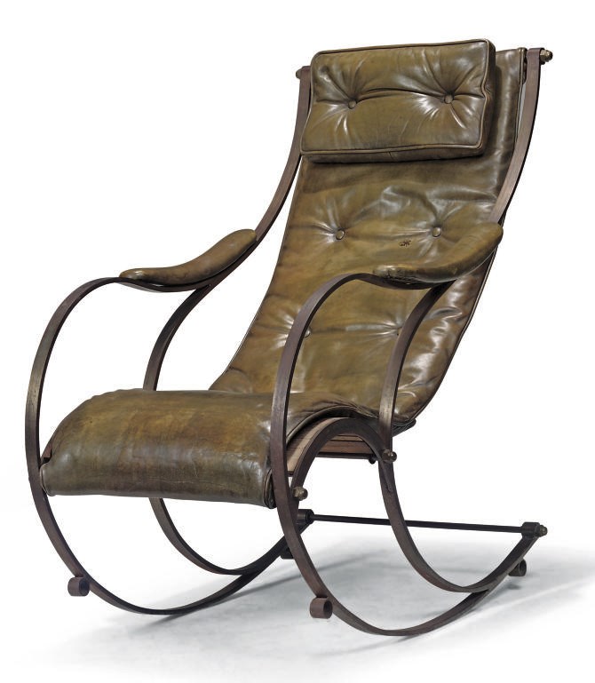 A VICTORIAN STEEL AND BRASS ROCKING CHAIR