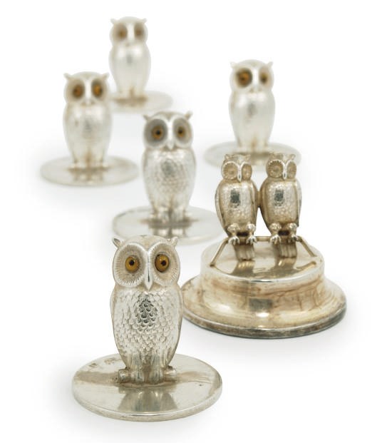 A MATCHED SET OF FIVE NOVELTY EDWARDIAN AND LATER SILVER OWL MENU HOLDERS