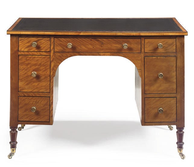 A VICTORIAN SATINWOOD AND EBONY STRUNG KNEE HOLE DESK