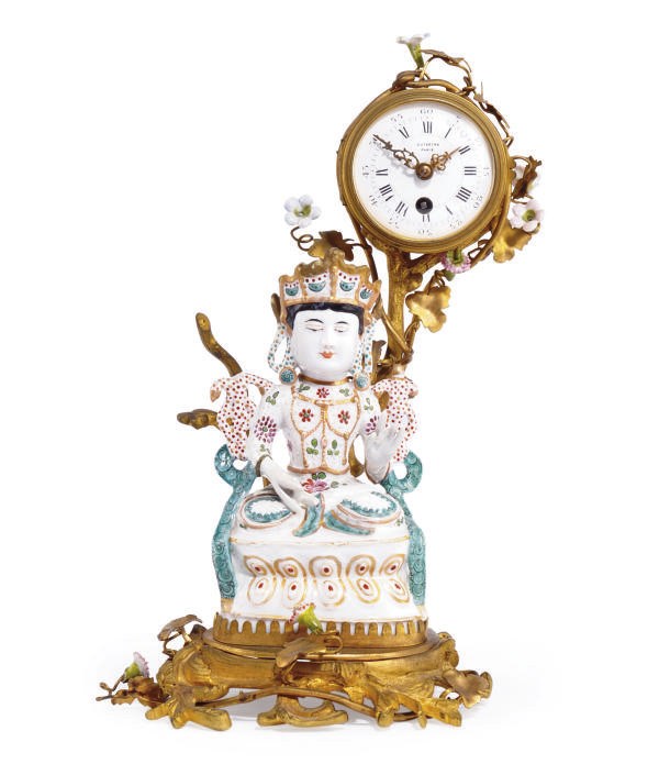 A FRENCH GILT-BRONZE AND PORCELAIN MANTLE CLOCK