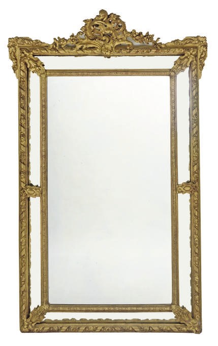 A NORTH EUROPEAN GILT WOOD AND COMPOSITION MARGINAL MIRROR