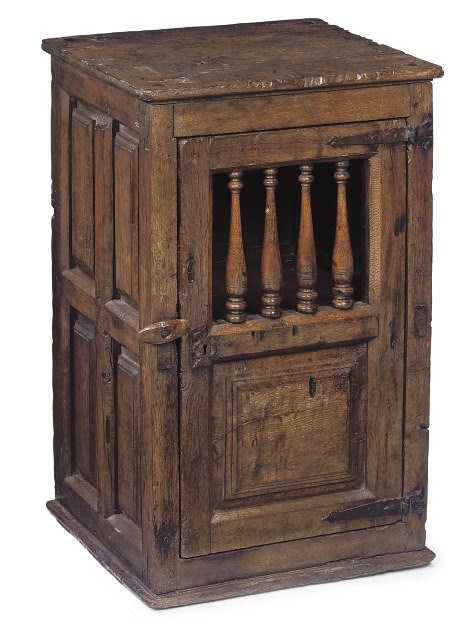 A SPANISH OAK AND CHESTNUT CUPBOARD