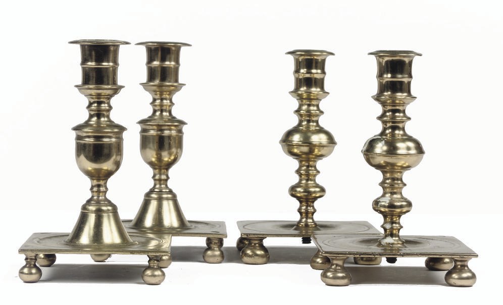 TWO PAIRS OF NORTH EUROPEAN BRASS CANDLESTICKS