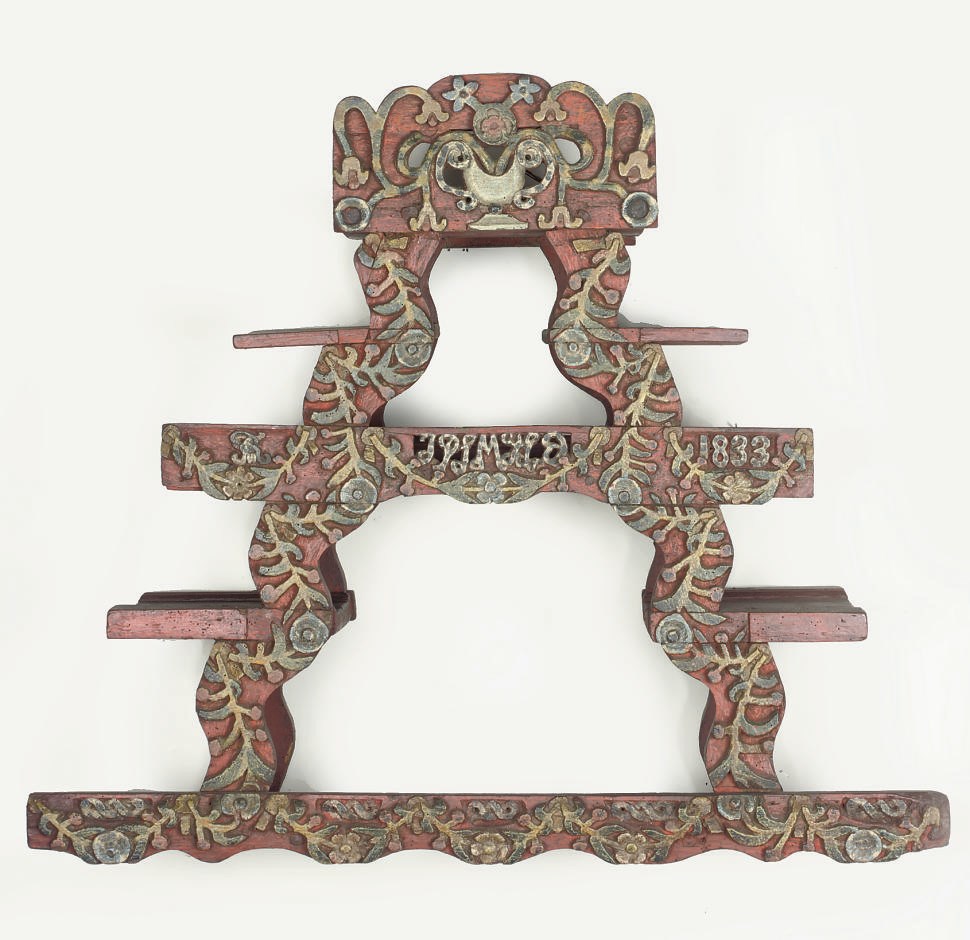 A SCANDINAVIAN POLYCHROME DECORATED AND CARVED WOOD WALL ETAGERE