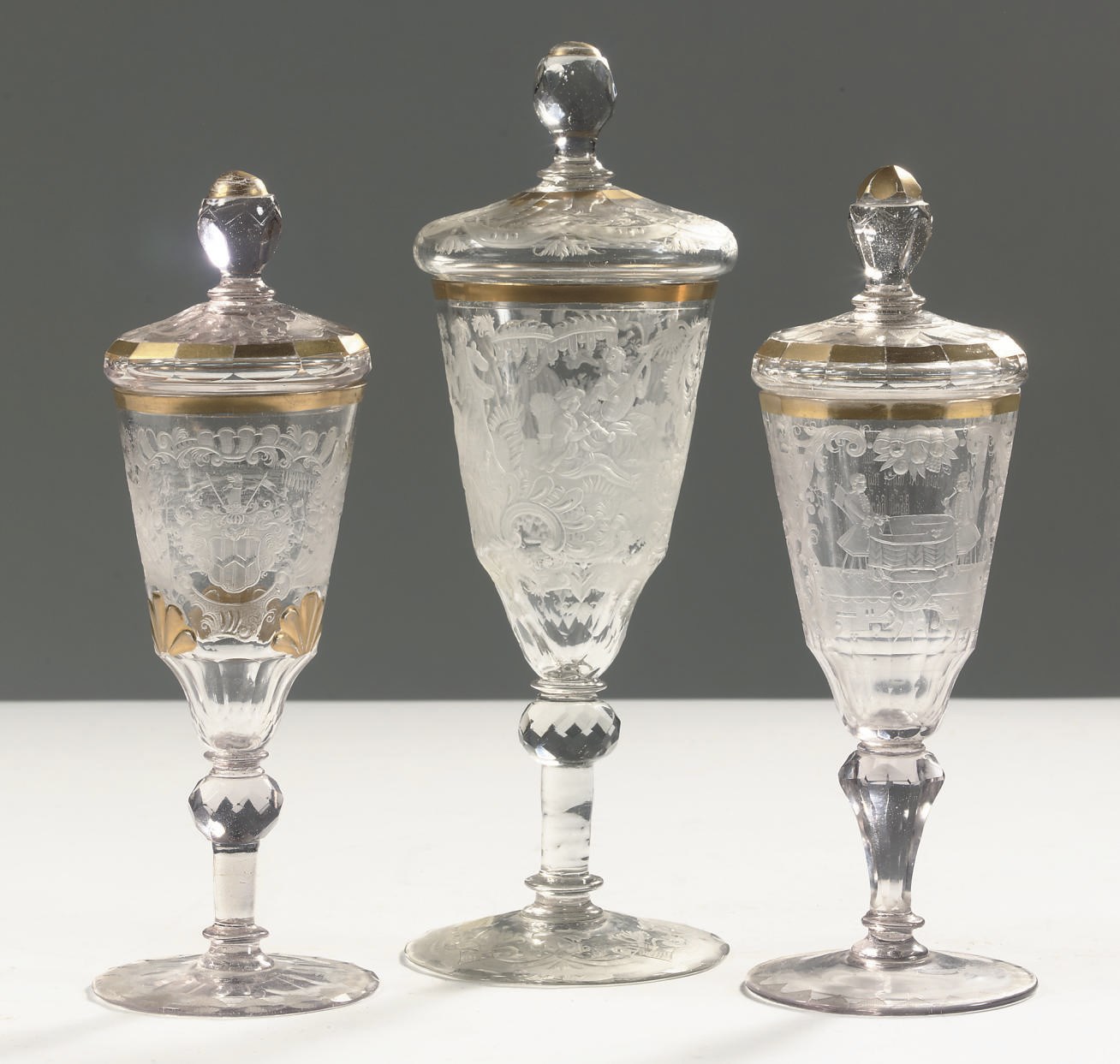 Three Silesian engraved gilt goblets and covers