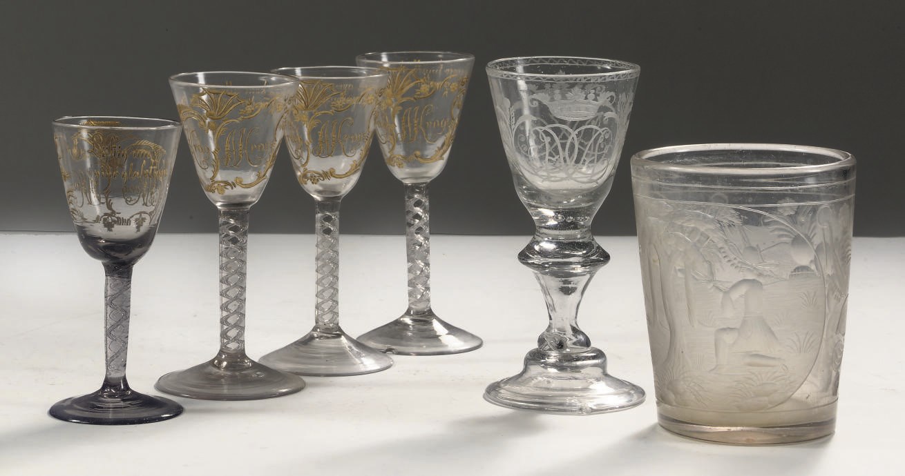 A set of four Nöstestangen Norwegian gilt monogrammed air-twist wine glasses, an engraved German goblet and an engraved vase