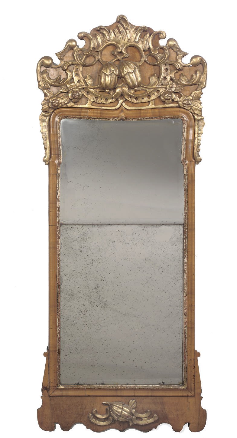 A DANISH WALNUT AND PARCEL-GILT MIRROR
