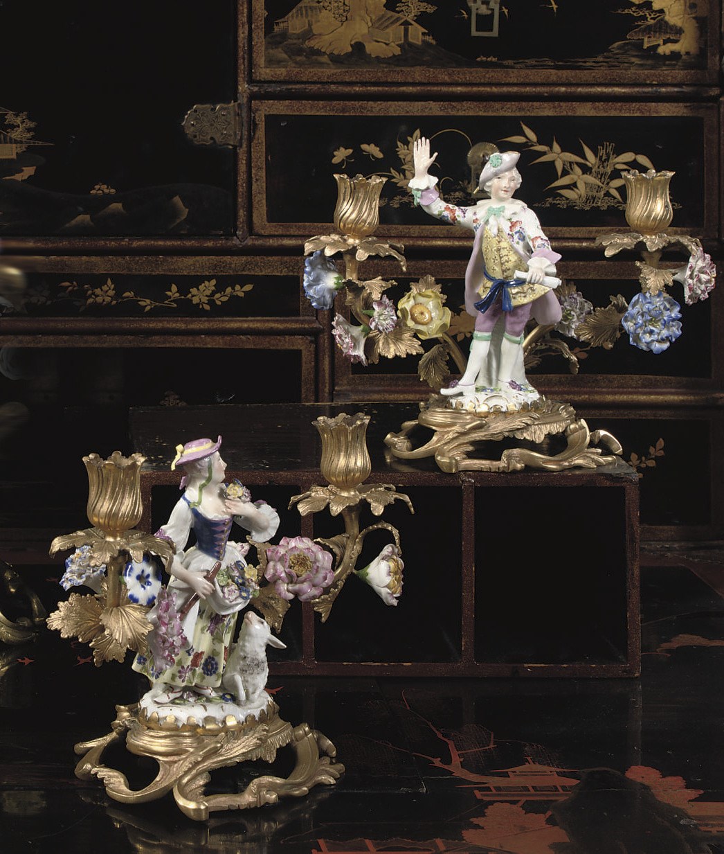 A PAIR OF PORCELAIN-MOUNTED AND ORMOLU FIGURAL CANDELABRA
