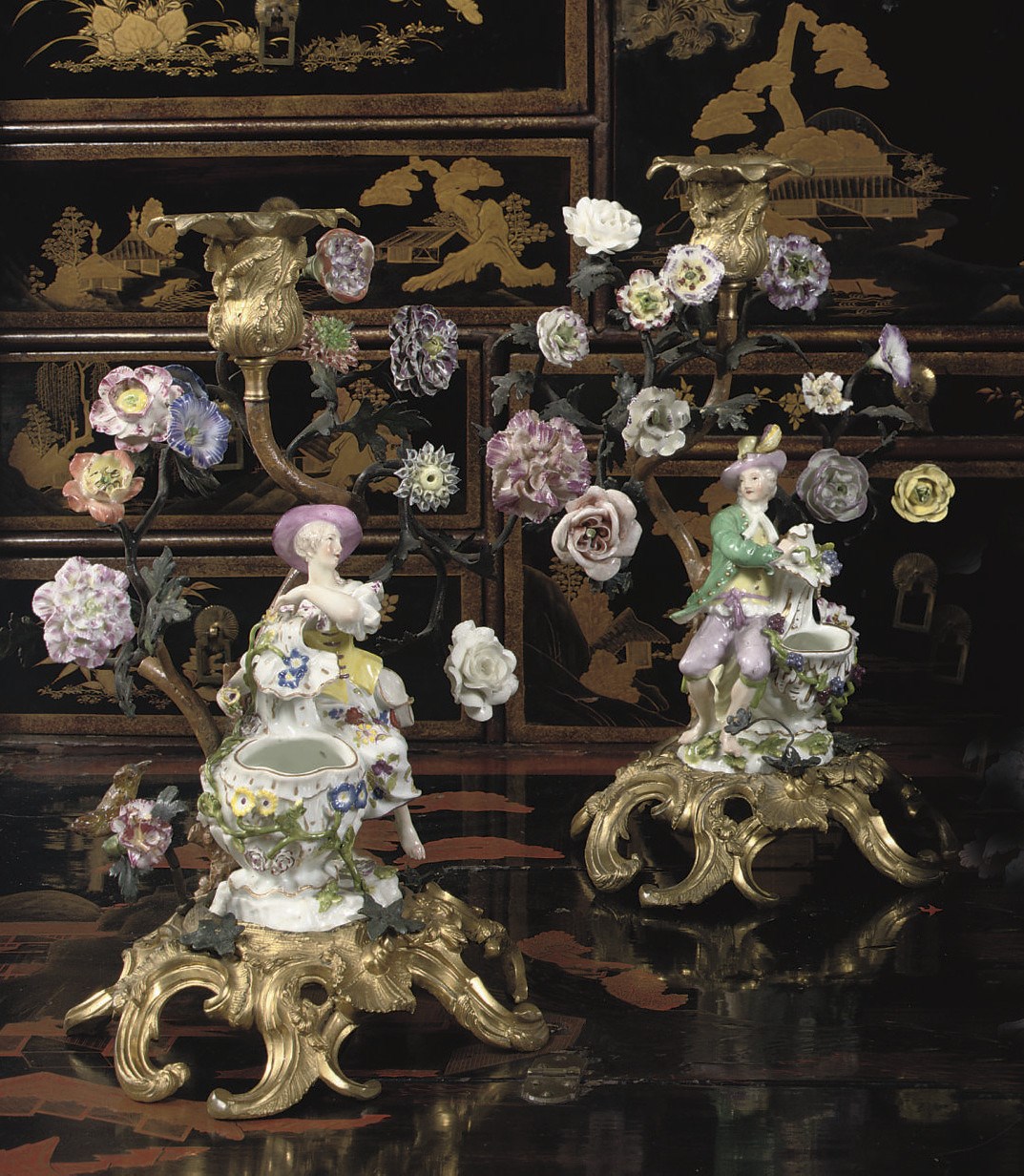 A PAIR OF LOUIS XV PORCELAIN-MOUNTED AND ORMOLU CANDLESTICKS