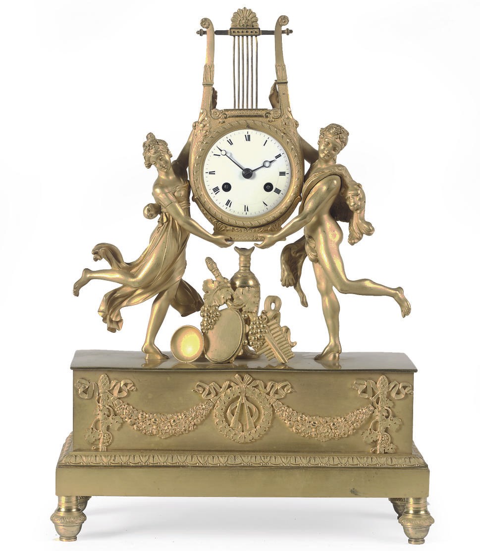 AN EMPIRE ORMOLU FIGURAL LYRE STRIKING MANTEL CLOCK